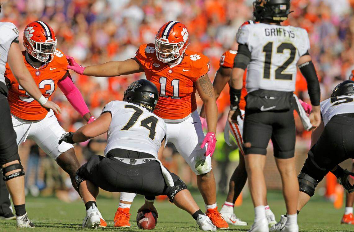 Clemson defensive tackle Peter Woods (11) tells Clemson defensive tackle Ruke Orhorhoro (33) to slide down the line before a Wake Forest snap in Clemson, S.C. on Saturday, Oct. 7, 2023. (Travis Bell/SIDELINE CAROLINA)