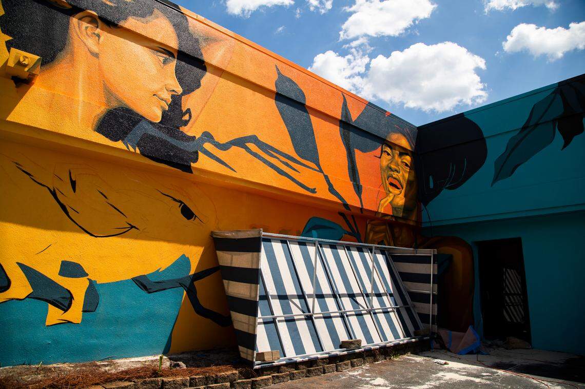 An awning covers a mural by McClellan Douglas that was vandalized with a racial slur and threat of violence on Friday, July 3, 2020. The unfinished mural wraps around the Realty Haven building near the corner of Rosewood Drive and Assembly Street.
