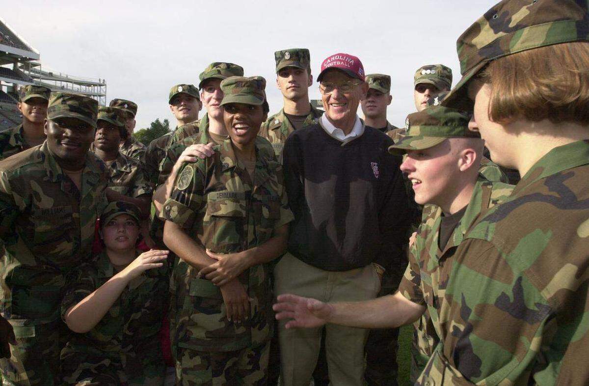 Sept. 20, 2001: USC head coach Lou Holtz offers words of encouragement before the start of the South Carolina at Mississippi State football game.