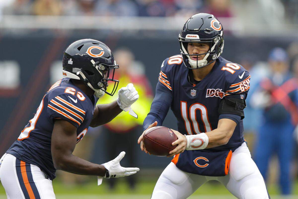 Chicago Bears quarterback Mitchell Trubisky (10) hands off to running back Mike Davis (25) during the first half of an NFL football game against the New Orleans Saints in Chicago, Sunday, Oct. 20, 2019. (AP Photo/Michael Conroy)