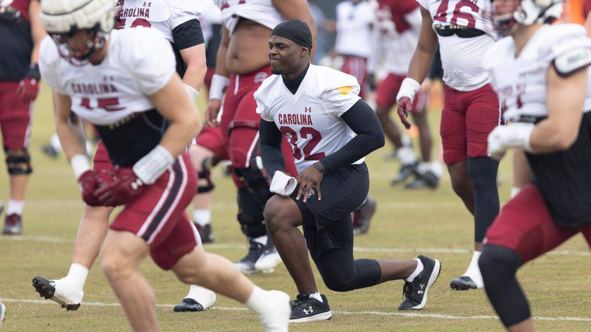 South Carolina linebacker Mo Kaba (32) stretches during the Gamecocks’ practice in Columbia on Thursday, March 23, 2023.