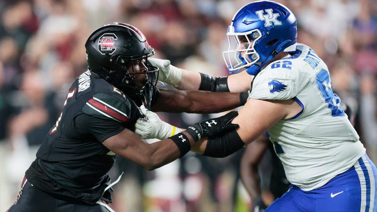 South Carolina defensive back Nick Emmanwori (21) goes against Kentucky offensive lineman Jager Burton (62) at Williams-Brice Arena on Saturday, November 18, 2023.