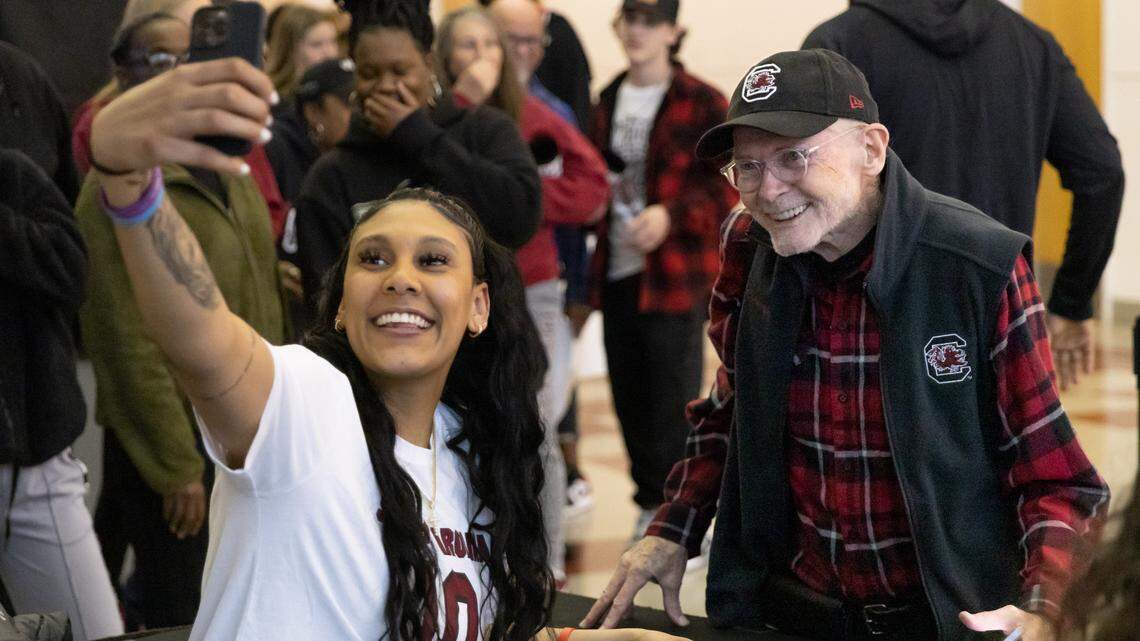 Gamecock Kamilla Cardoso takes a selfie with USC fan Michael Sullivan during the Gamecocks’ NCAA Selection Show Event at Colonial Life Arena on Sunday, March 12, 2023.