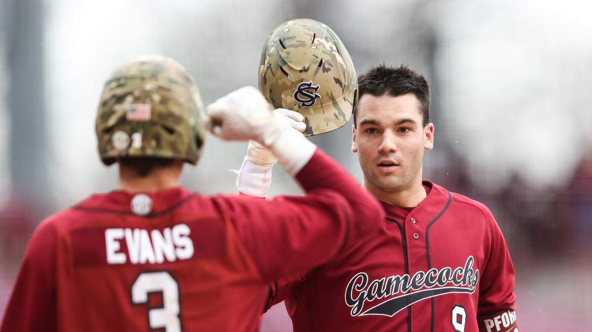 South Carolina infielder Will Craddock (9) is congratulated by infielder Patrick Evans (3) after hitting a home run during South Carolina’s game against Navy at Founders Park in Columbia on Saturday, February 21, 2026.