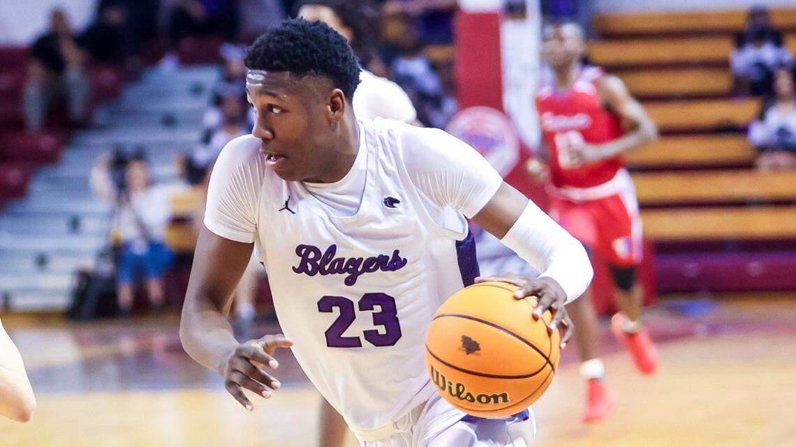 Ridge View Blazers Gregory GG Jackson (23) drives around Fort Dorchester Patriots Collin Shepard (15) during the Class 5A Boys SC State Championships at the University of South Carolina Aiken Thursday, March 3, 2022.