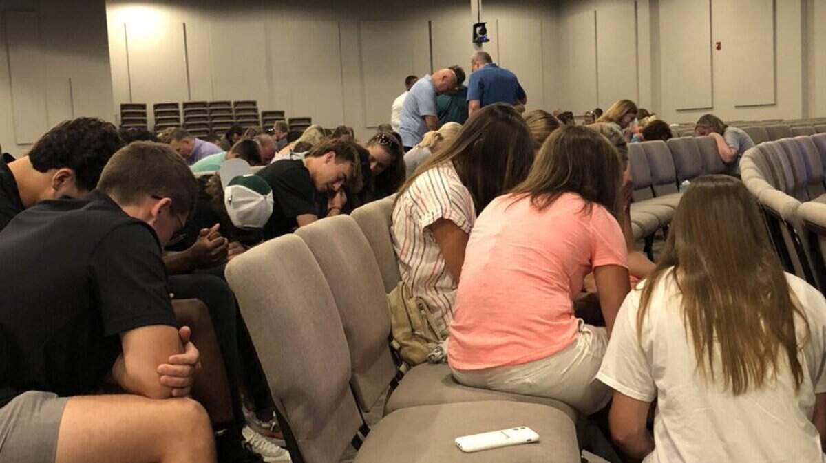 Members of the Lexington community pray for the recovery of the Smith family after they were injured in a car crash while on vacation in Hawaii.