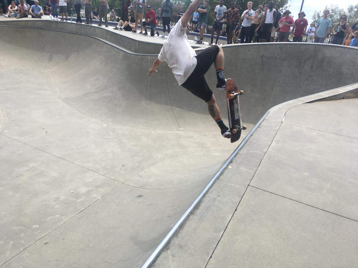 Connor Lock hops off the coping of the bowl with a blunt fakie