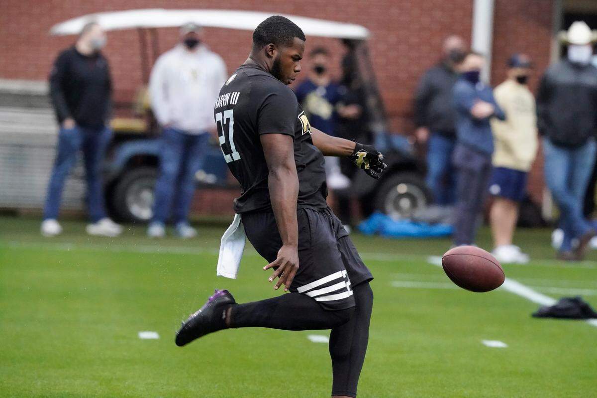 Georgia Tech punter Pressley Harvin III punts the ball during the school’s pro day football workout for NFL scouts in Atlanta.