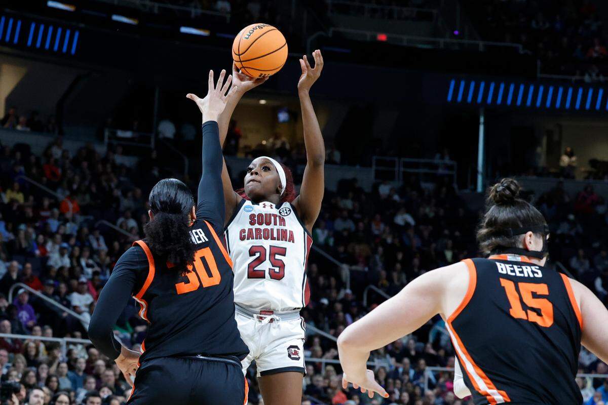 South Carolina’s Raven Johnson (25) shoots over Oregon State’s Timea Gardiner (30) during the Elite Eight round of the NCAA Tournament at the MVP Arena in Albany, New York on Sunday, March 31, 2024.