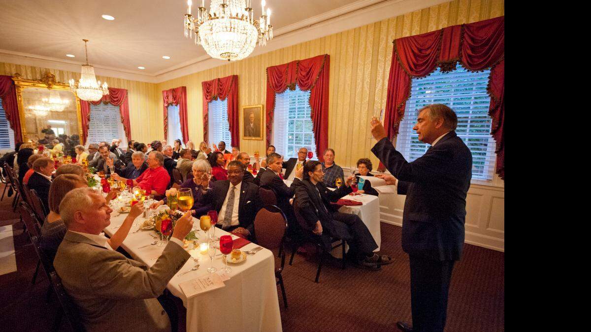
USC president Harris Pastides presents a toast at a feast commemorating Nat Fuller Sunday evening in the McCutchen house on the Horseshoe.
