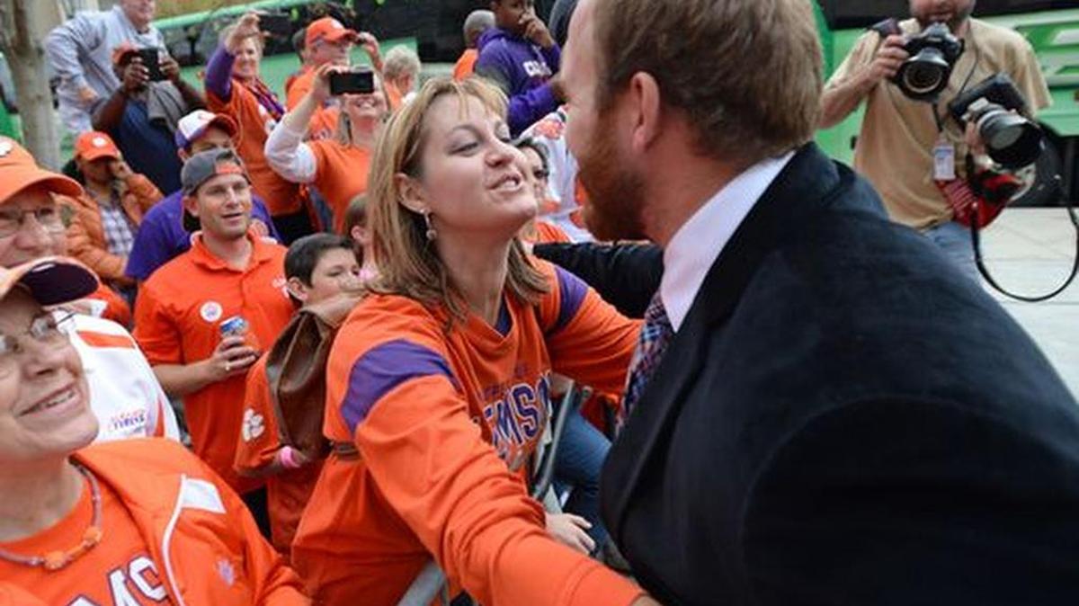 Clemson offensive lineman Eric Mac Lain is greeted by his family earlier this year as the team arrived at Boston College’s Alumni Stadium.
