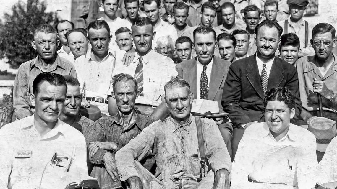 A Bible study group at CCI, around 1944. The Rev. Charles M. “Red” Kelly, who served as prison chaplain, is shown in the dark suit and tie, near the bottom right of the photo.