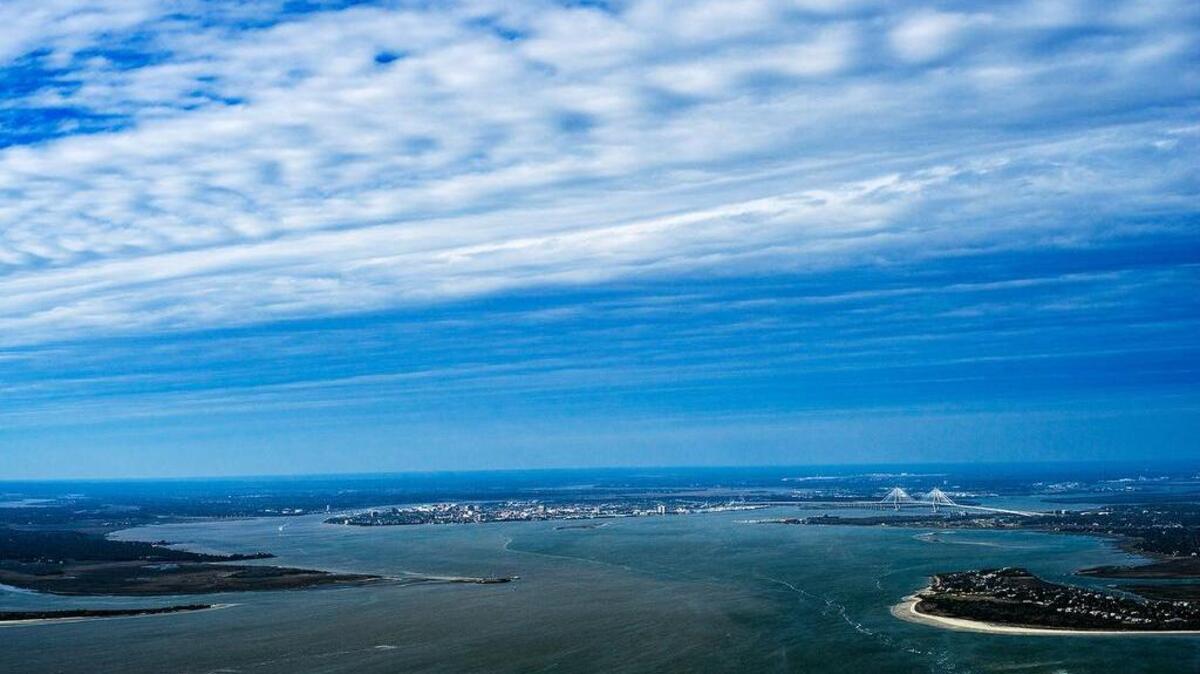 “City of Charleston under Approaching Storm, Seen through Harbor Entrance,” by J Henry Fair.