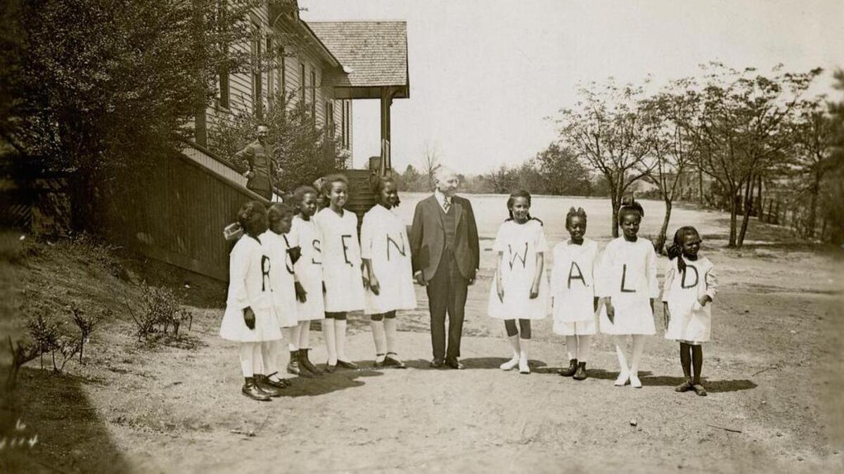 Philanthropist Julius Rosenwald and some of the students from a Rosenwald school.