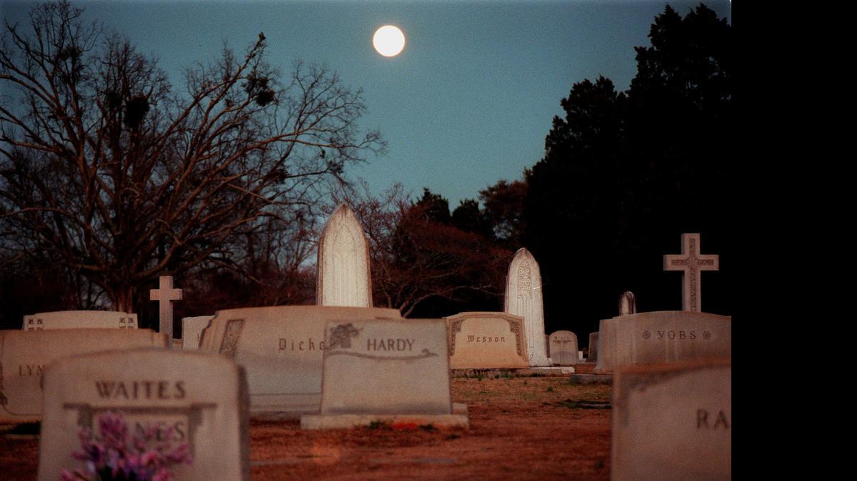
A full moon rises over historic Elmwood Cemetery.
