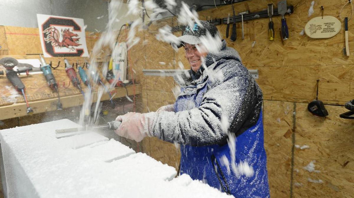 Edwin Hutchinson, owner of the ice-sculpting business Ice Age Greenville, works in his freezer.