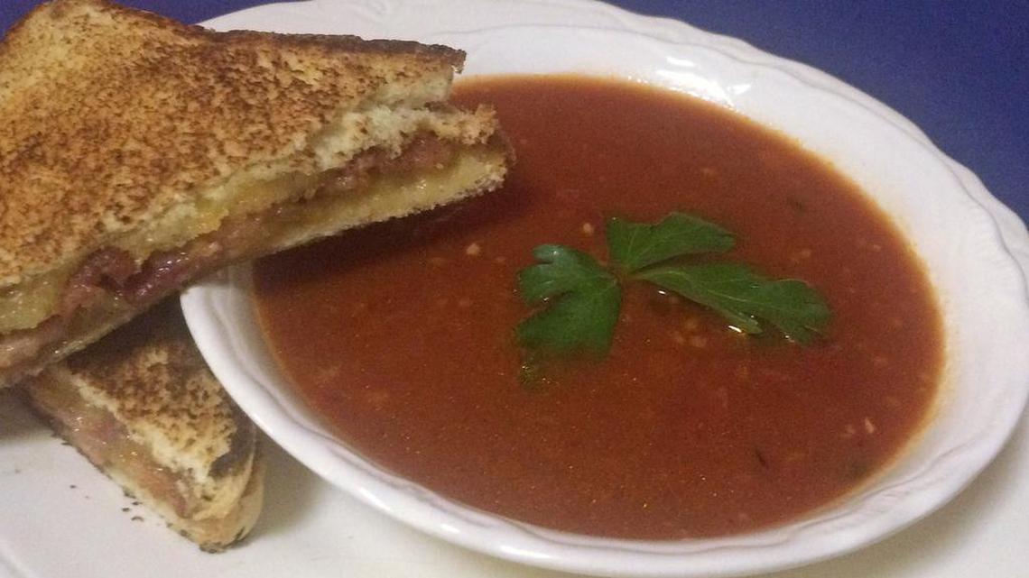 Classic comfort food combination: grilled cheese, with bacon, and tomato soup