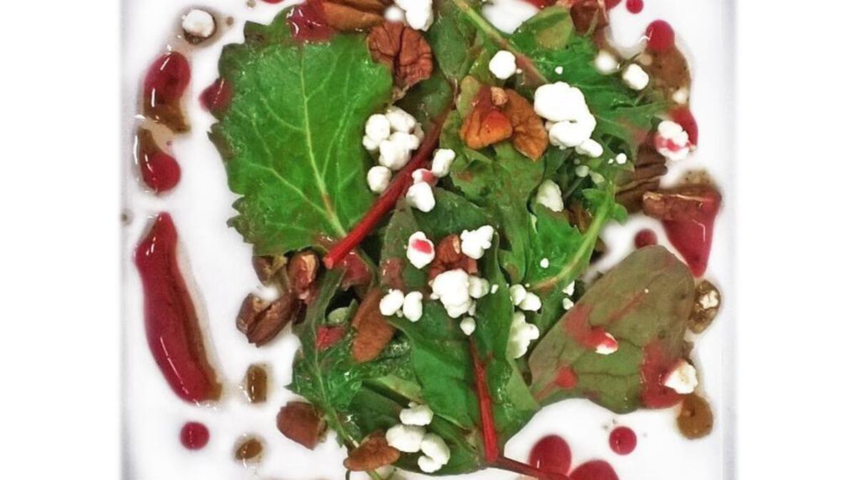 Baby Kale, Toasted Nuthouse Pecan and Trail Ridge Farm Goat Cheese Salad with Cranberry-Ginger Vinaigrette from Chef Brandon Velie of Juniper in Ridge Spring.