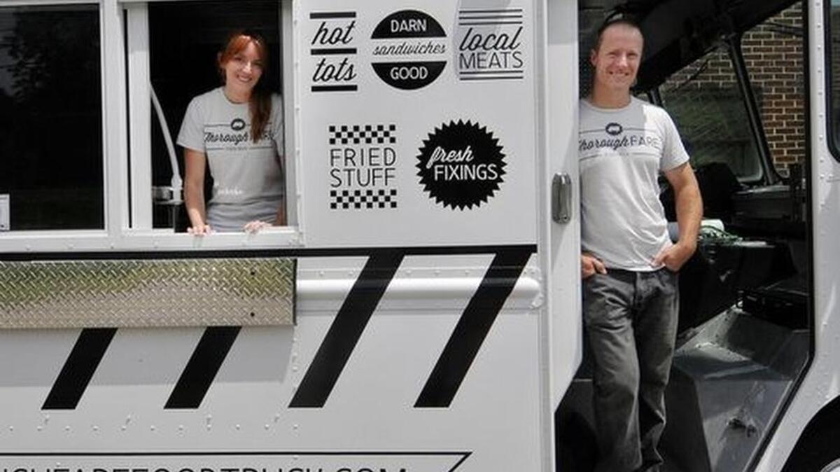
Jessica and Neil Barley pose with their Greenville food truck ThoroughFARE. 
