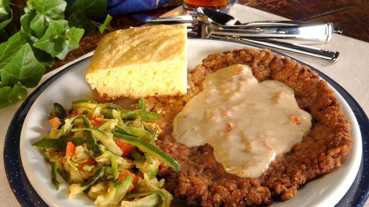 Chicken-fried steak and a side of shredded zucchini can create a quick and satisfying weeknight supper.