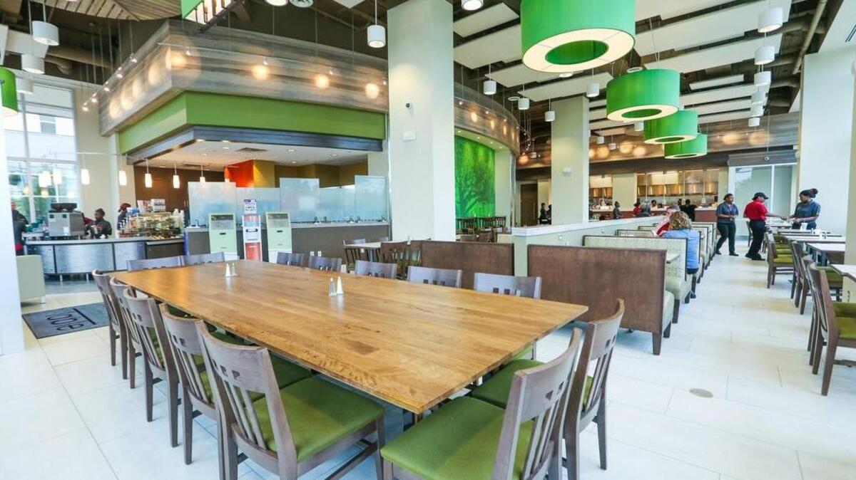 The Community Table, USC's new dining facility opens Tuesday at 650 Lincoln. The restaurant gets it's name from this table that is made of wood from the large oak tree that blew over on the Horseshoe. The hours of operation are 7 am to 12 midnight. 10/26/15