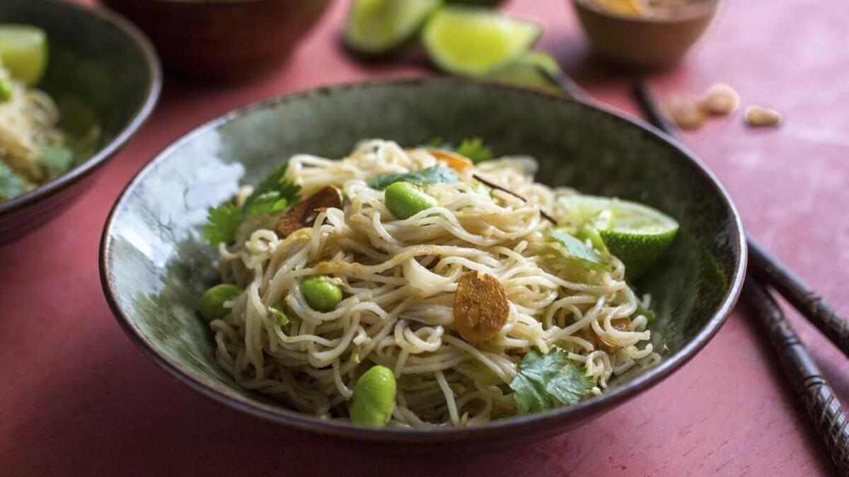 Pan fried noodles, a go-to dish with garlic, ginger, lime and peanuts. The simple recipe for spicy pan-fried noodles is quick to make and applies Asian condiments usually found in a pantry. A great way to start the New Year.