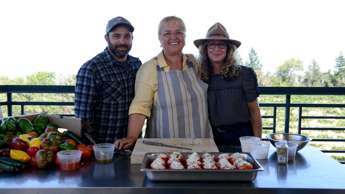 Host Lidia Bastianich (center) prepares stuffed tomatoes and porchetta with Army veteran Jon Darling and his wife, Tara, of McClellanville. ‘Lidia Celebrates America: Homegrown Heroes’ premiers on PBS on December 15, 2017.
