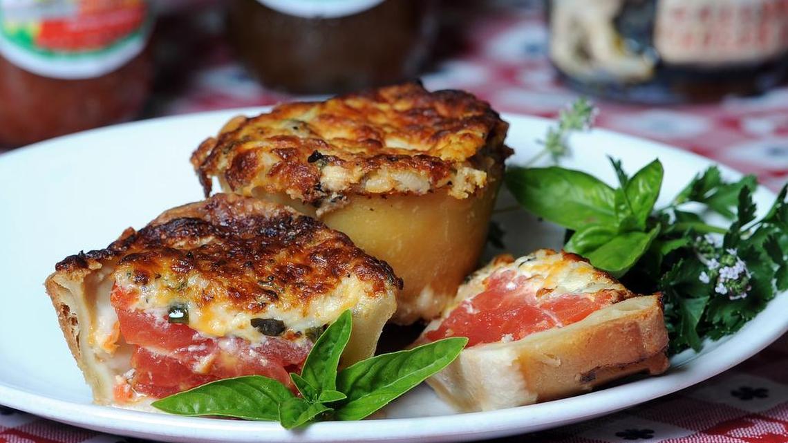 
Individual tomato pies at Grits and Groceries feature an all-butter crust created by Joe Trull.
