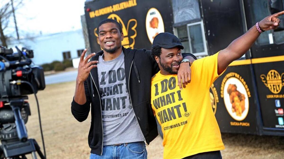 Ramone Dickerson, right, and Corey Simmons, left, owners of 2 Fat 2 Fly. Dickerson has been named a Chef Ambassador for 2016.