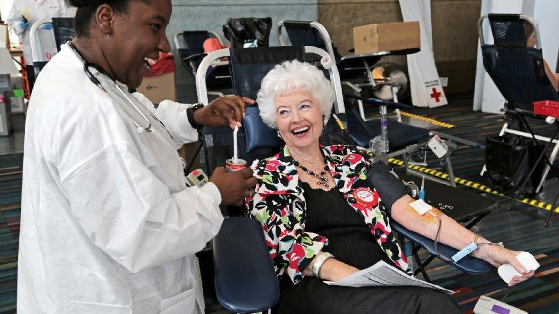 FILE PHOTO: Alexandra Saint, left, laughs with Charlotte Berry, of Columbia, as she gives blood during the Famously Hot Blood Drive inside the Columbia Metropolitan Convention Center, Friday, June 20, 2014.