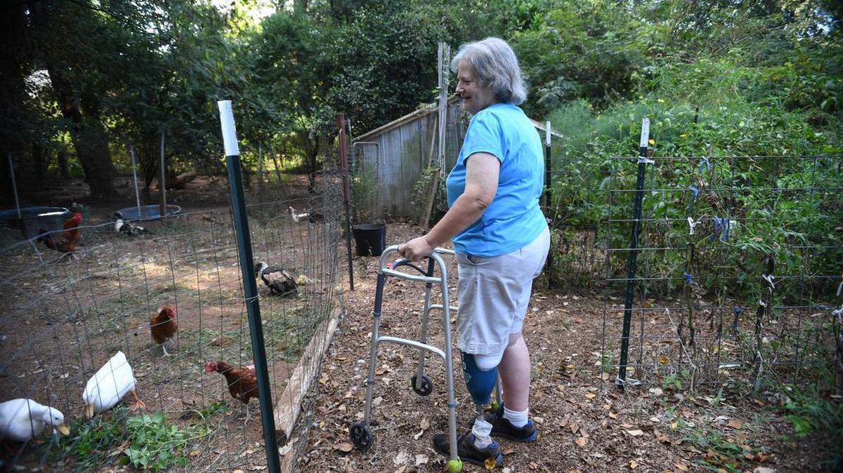 Mary Lynn Bushong, who had her foot aputated after learning she had sepsis, still spends time gardening.
