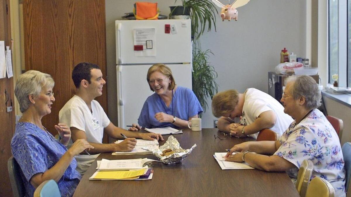 Nurses with S.C. Department of Health & Environmental Control, start a meeting off with a little bit of humor on at the Richland County Health Department. Linda Sweet, from left, Billy Wiggins, Sally Green, Jean Jackson and Jane Etheredge all work with tuberculosis patients in Richland County.