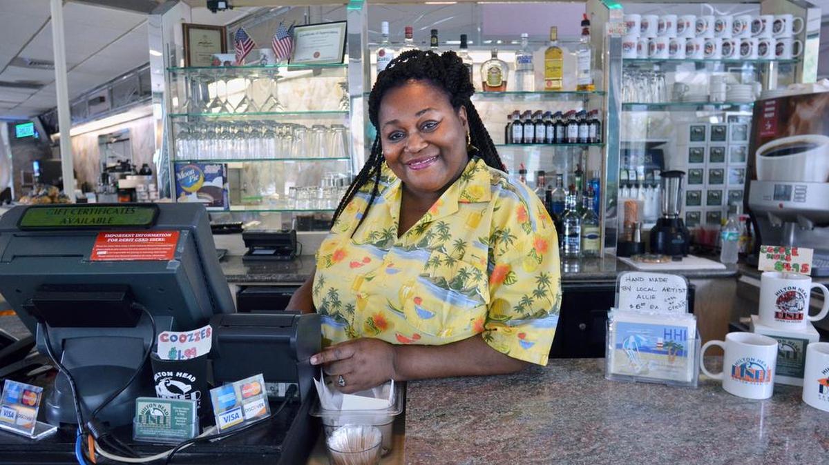 Daraleen Webber is behind the counter at Hilton Head Diner, where she has worked while bringing up four children as a single mother.