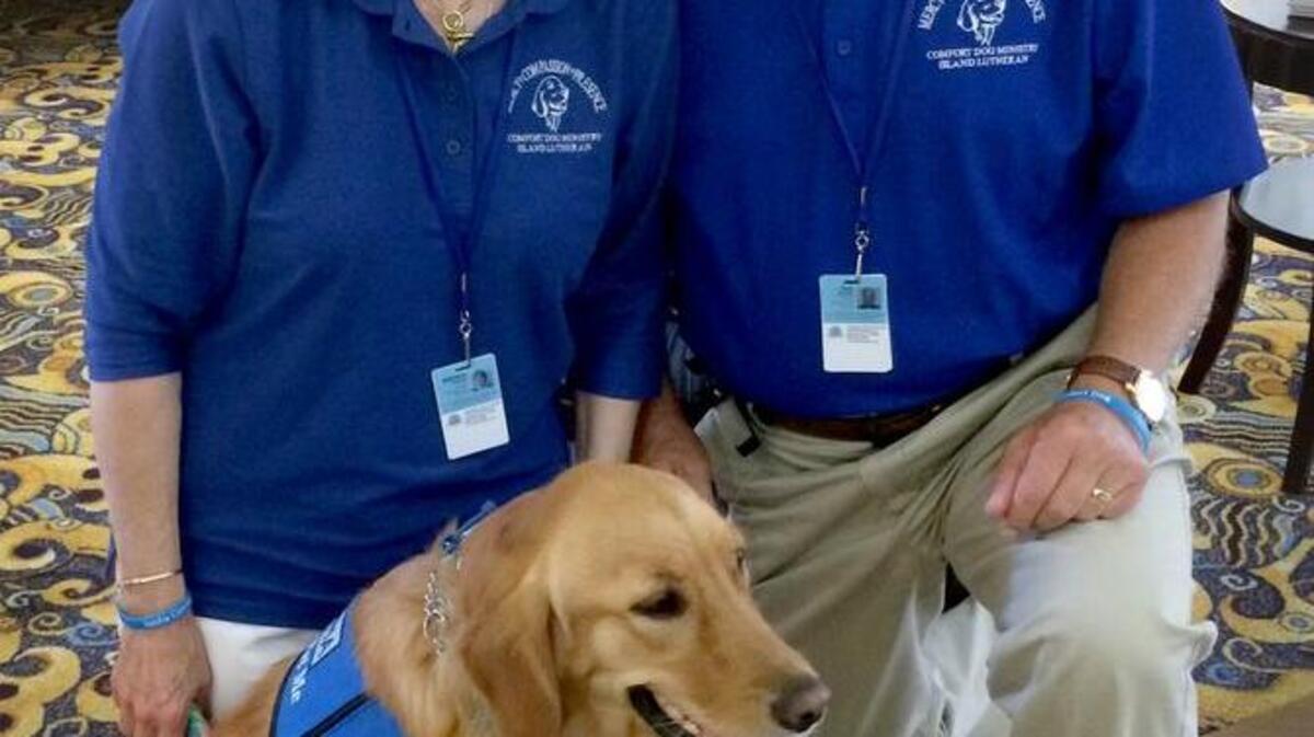 Brenda and Phil Burden pose with Sasha Comfort Dog on the afternoon of June 13, 2016, in Orlando. The Burdens and Sasha have been dispatched to comfort victims and first responders who were affected by Sunday morning’s mass shooting that occurred at Pulse nightclub in Orlando.