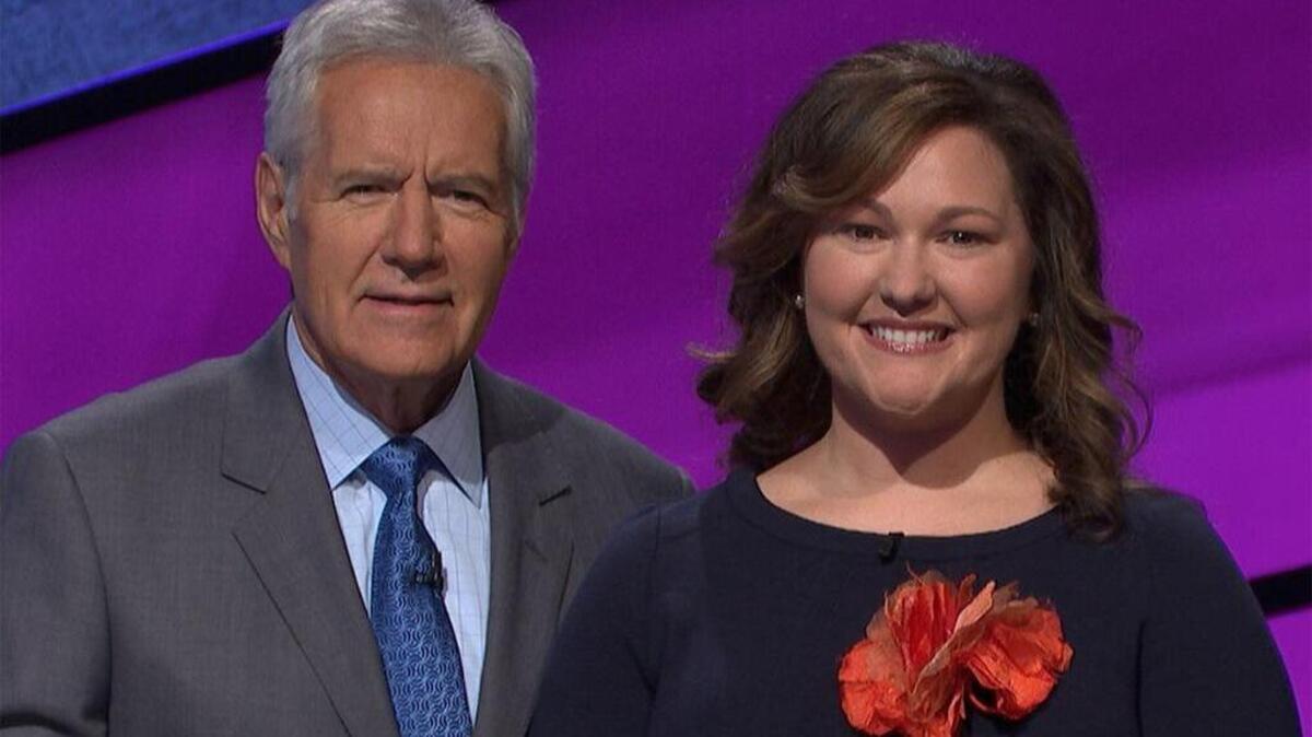 Jeopardy host Alex Trebeck, left, with USC grad Katie Champagne.