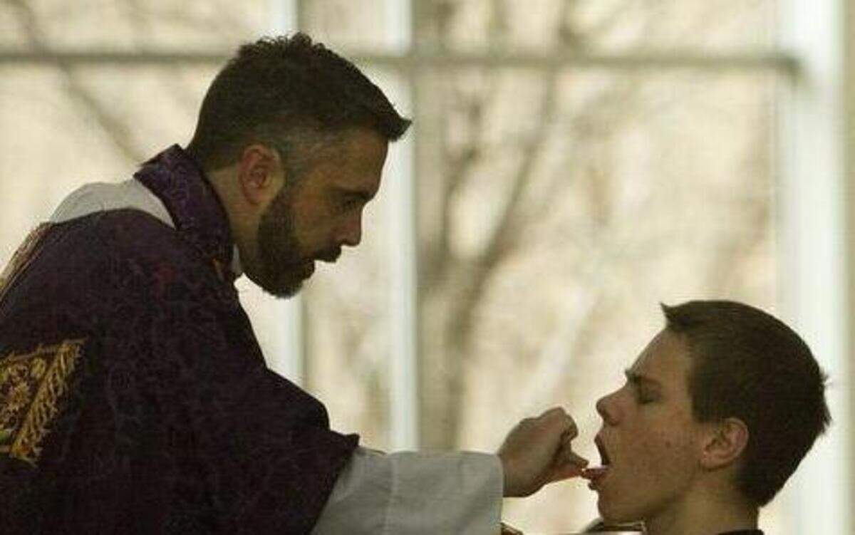 
Father Christopher Smith, the pastor at Prince of Peace Catholic Church, holds traditional Latin Mass in the Extraordinary Form of the Roman Rite.
