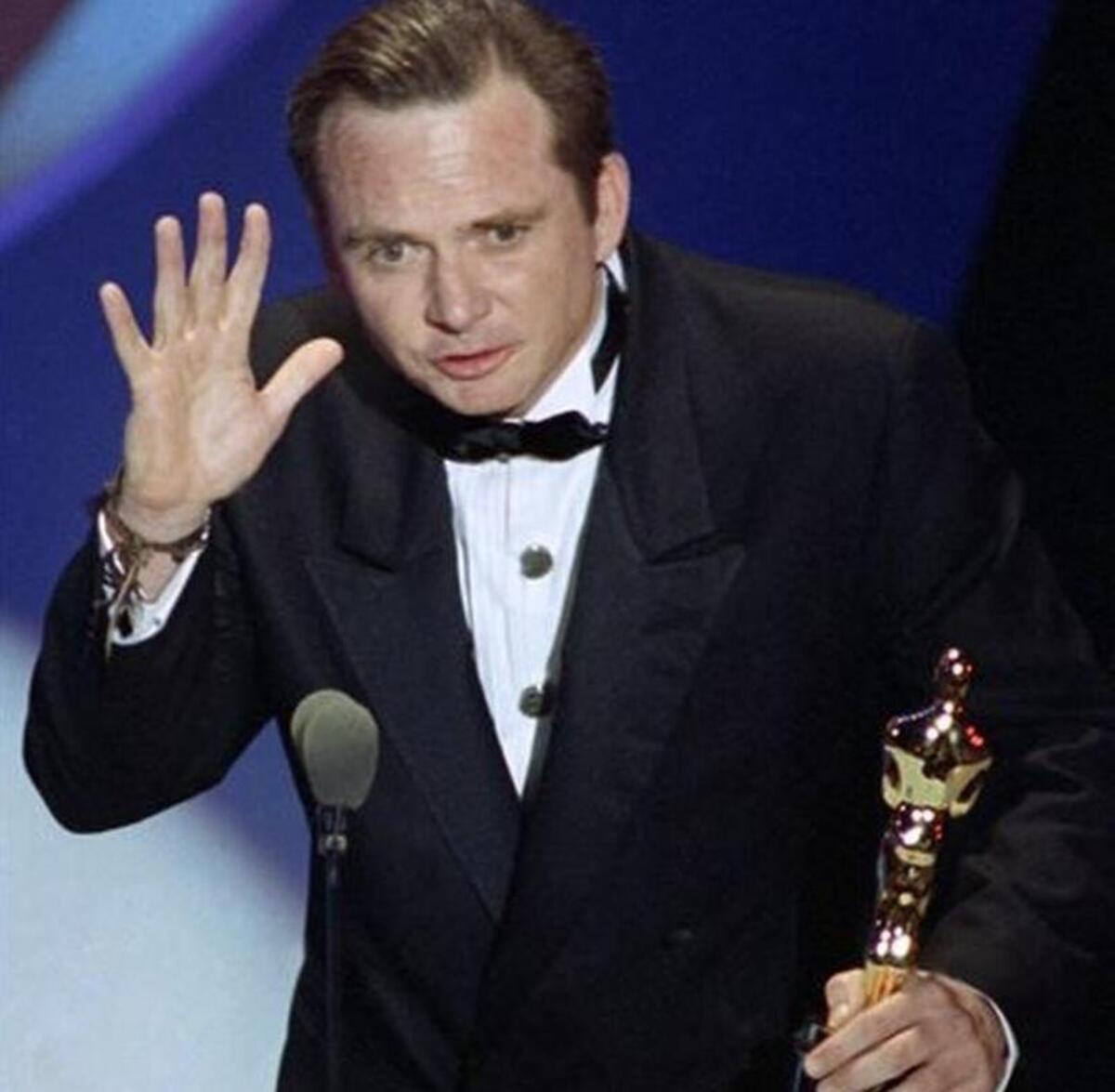 
 Michael Blake acceps the Oscar for best adapted screenplay for "Dances with Wolves" at the 63rd Annual Academy Awards in Los Angeles, March 26, 1991. Blake's business partner, Daniel Ostroff, says the 69-year-old died Saturday in Tucson, Ariz., after a long battle with cancer. 

