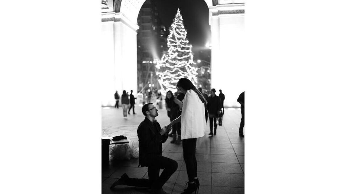 Det Cullum proposes to Olivia Towers-Solis in New York City’s Washington Square Park.