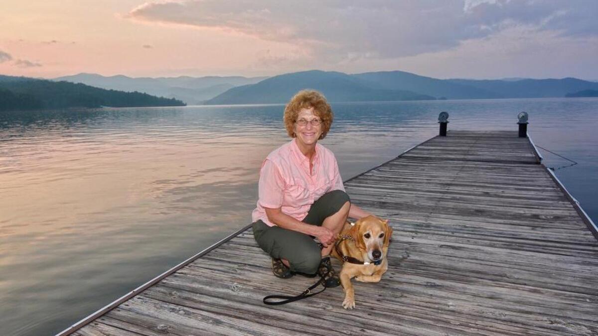 
Ann Chadwell Humphries with Brego at Lake Jocassee. Brego was awarded ‘Ultimate Outsider Status’ by the South Carolina State Parks, having stayed in 22 parks. The parks are commissioning an ‘Ultimate Outsider’ pillow for Brego.
