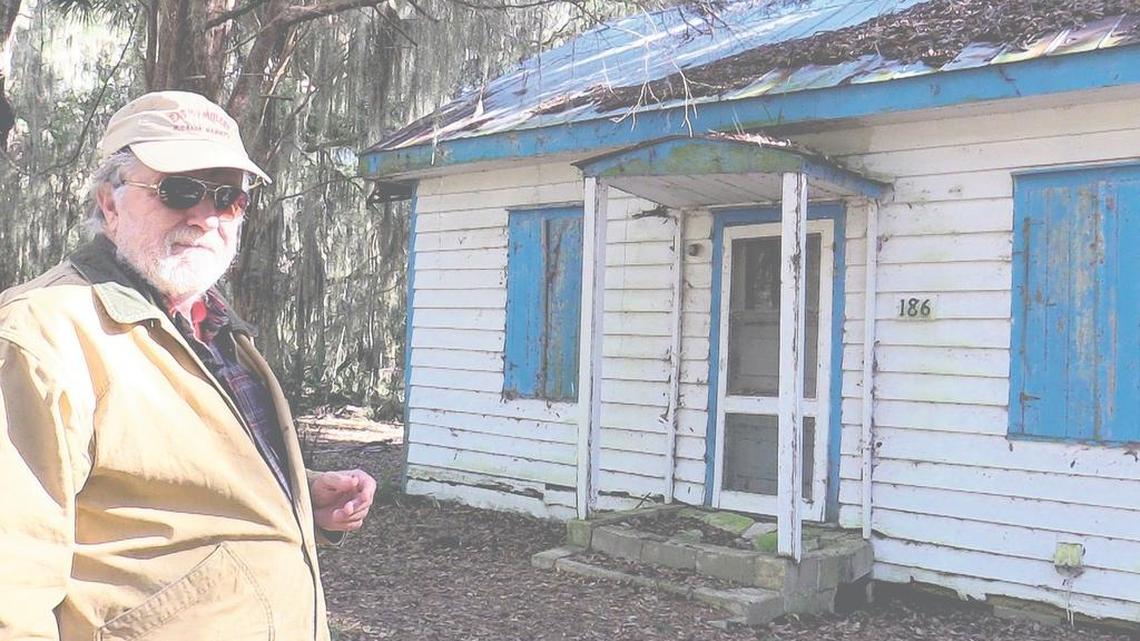 Roger Pinckney XI of Daufuskie Island, an author known for his belief in the spiritual tradition of voodoo, shows a home along Haig Point Road with its trim painted ‘haint’ blue. It’s a longtime Gullah tradition, Pinckney noted, to keep evil or ghosts out. ‘Ghosts,’ Pinckney says, ‘don't like blue.’