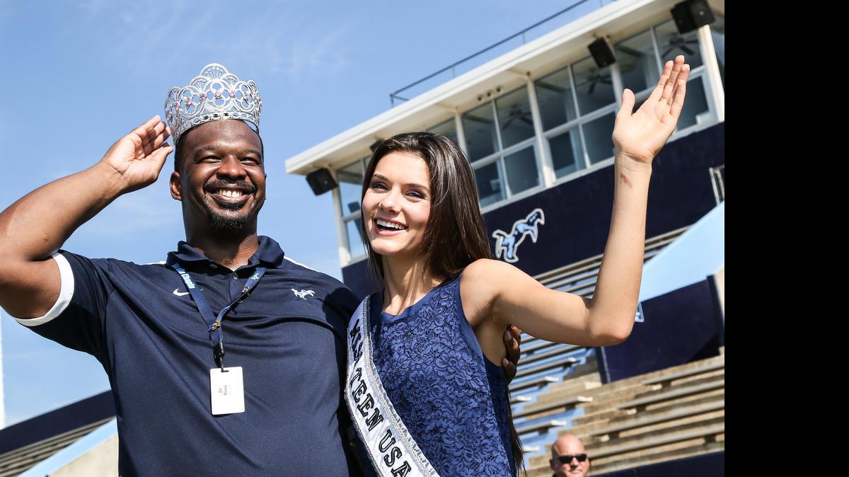 
Miss Teen USA, K. Lee Graham, shares her crown with Chapin High School principal Akil Ross after a homecoming celebration at the school. Graham visited the school for a class photo and was recognized for her accomplishments. Graham will finish her senior year by taking courses online.
