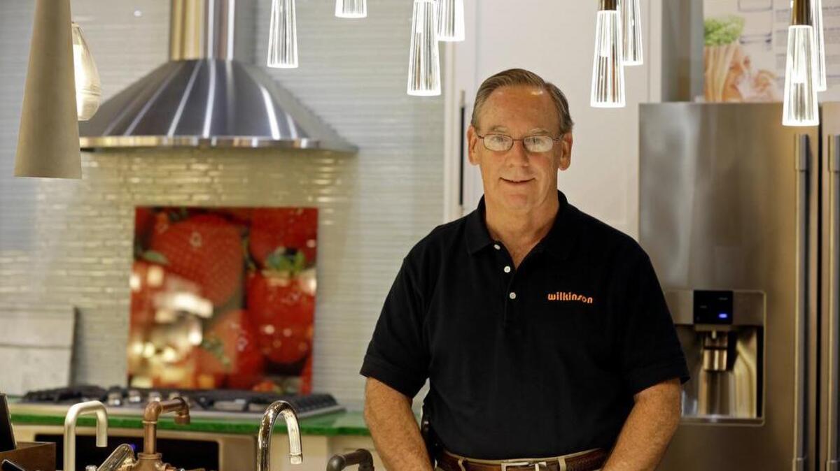 Ken Wertz, president of Wilkinson Supply, poses for a picture in the company's showroom that sells kitchen, bathroom, plumbing and decorative items, in Raleigh, N.C. Small businesses such as Wilkinson's Supply are preparing for an impending change in overtime.