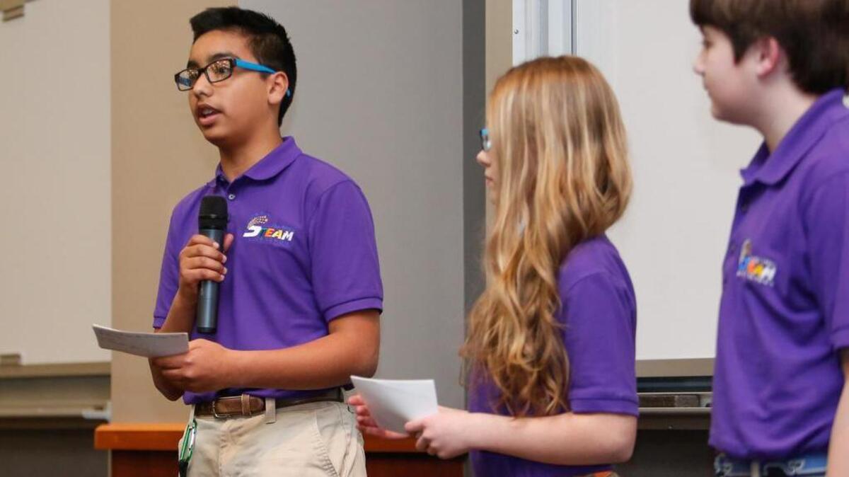 Zabdiel Hatten takes to the microphone during the Saluda Trail pitch as the Whitton Auditorium at Winthrop University hosts a Student Business Model "Pitch Night" Friday, 3-4-2016.