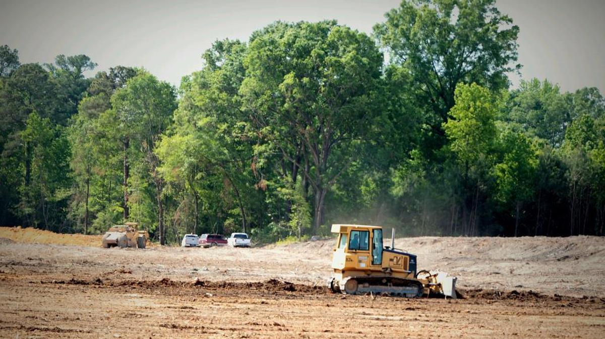 Crews continue to clear land along Bluff Road near I-77 for one of two travel centers planned for the intersection.