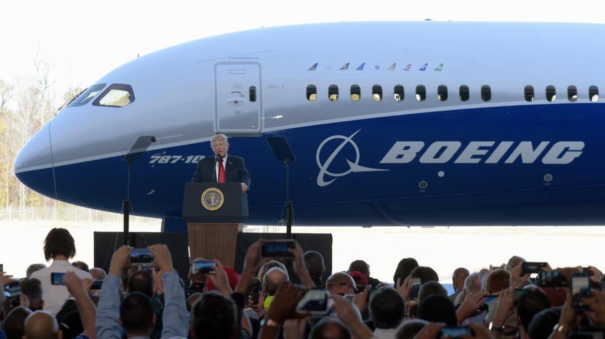 President Donald Trump speaks in front of a Boeing 787 Dreamliner while visiting the Boeing South Carolina facility in North Charleston in February. Trump’s push to get Americans to embrace goods “Made in USA” is harder than it looks. Few products are American-made only. Trump himself signs laws with gold-plated pens assembled in Rhode Island but lacquered and engraved in China. He praises U.S. industrial might in front of a Boeing jet whose parts are 30 percent foreign-made.