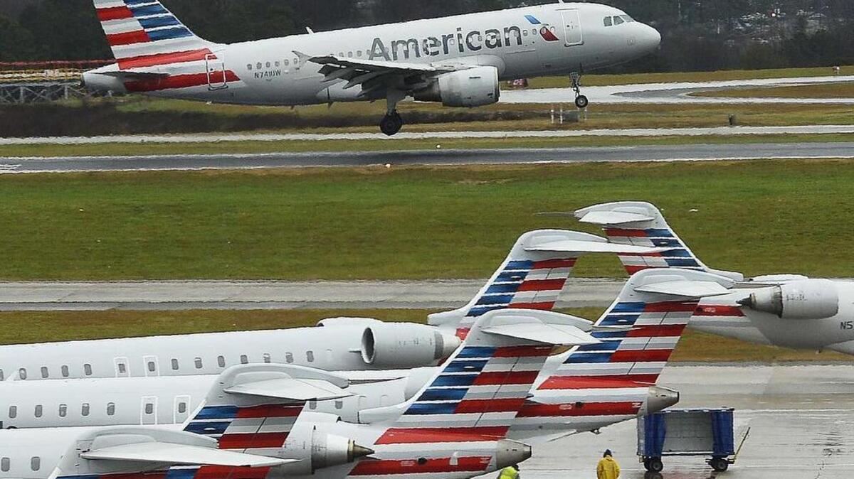 An American airlines jet takes off at Charlotte Douglas International airport on Dec. 23,2015.