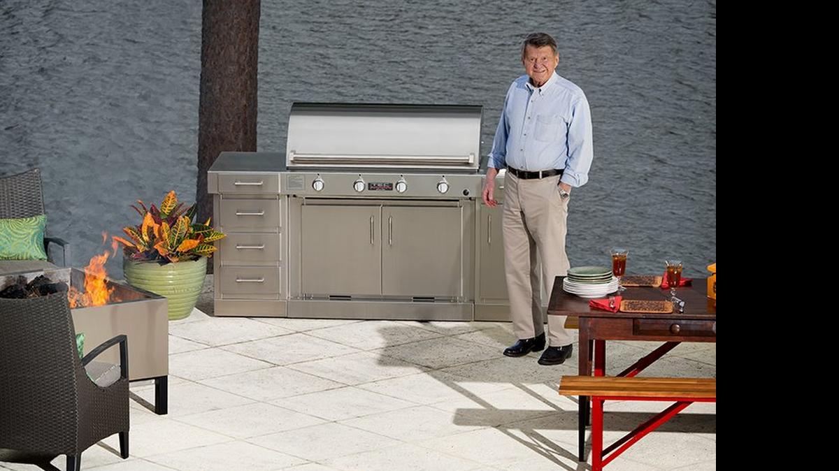 
Bill Best uses one of his company’s infrared grills at his home that overlooks a neighborhood lake at his Columbia-area home.
