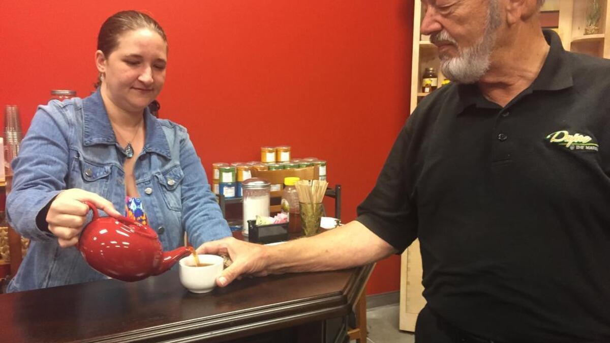 Jennifer Gerdes serves tea in her newly opened The Market Tea Room and Country Store at the State Farmers Market off Charleston Highway in West Columbia.