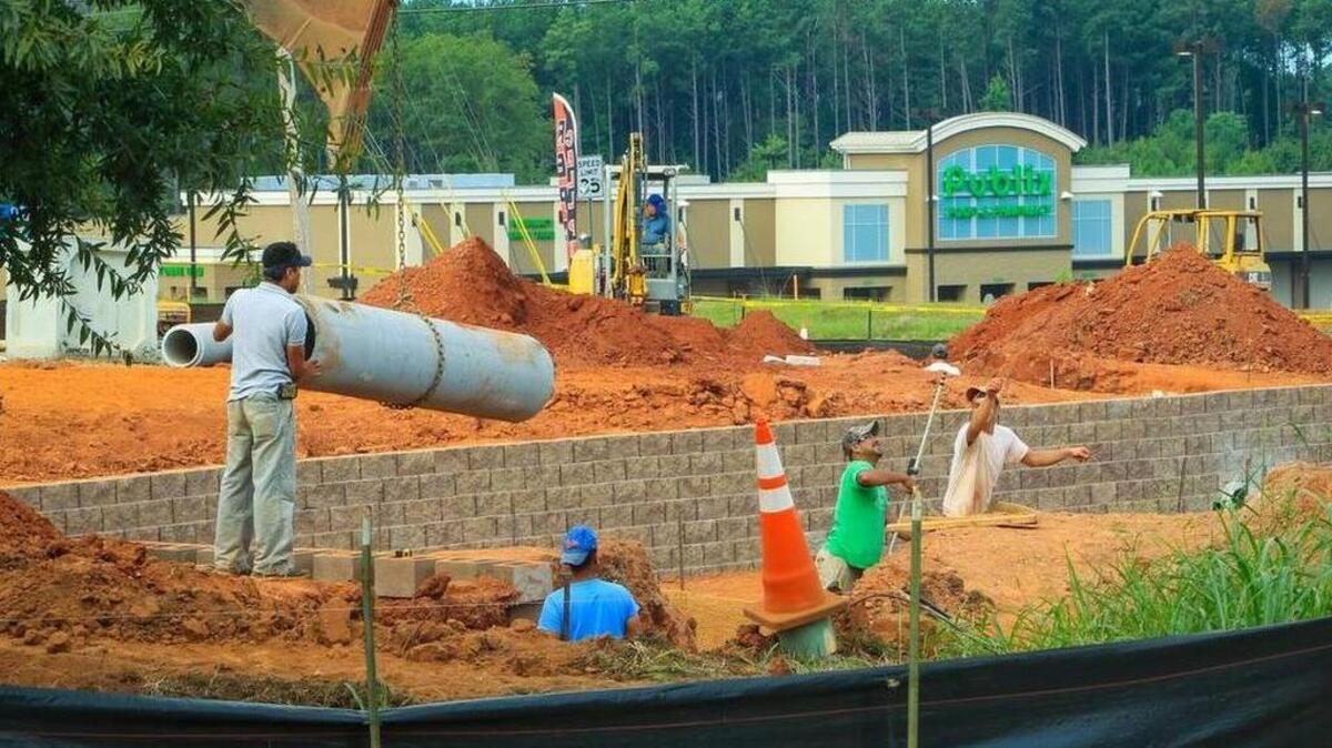 Construction crews work in late August on the foundation of the new Sonic Drive-In that will open next to the new Publix Supermarket at Chapin Crossing.