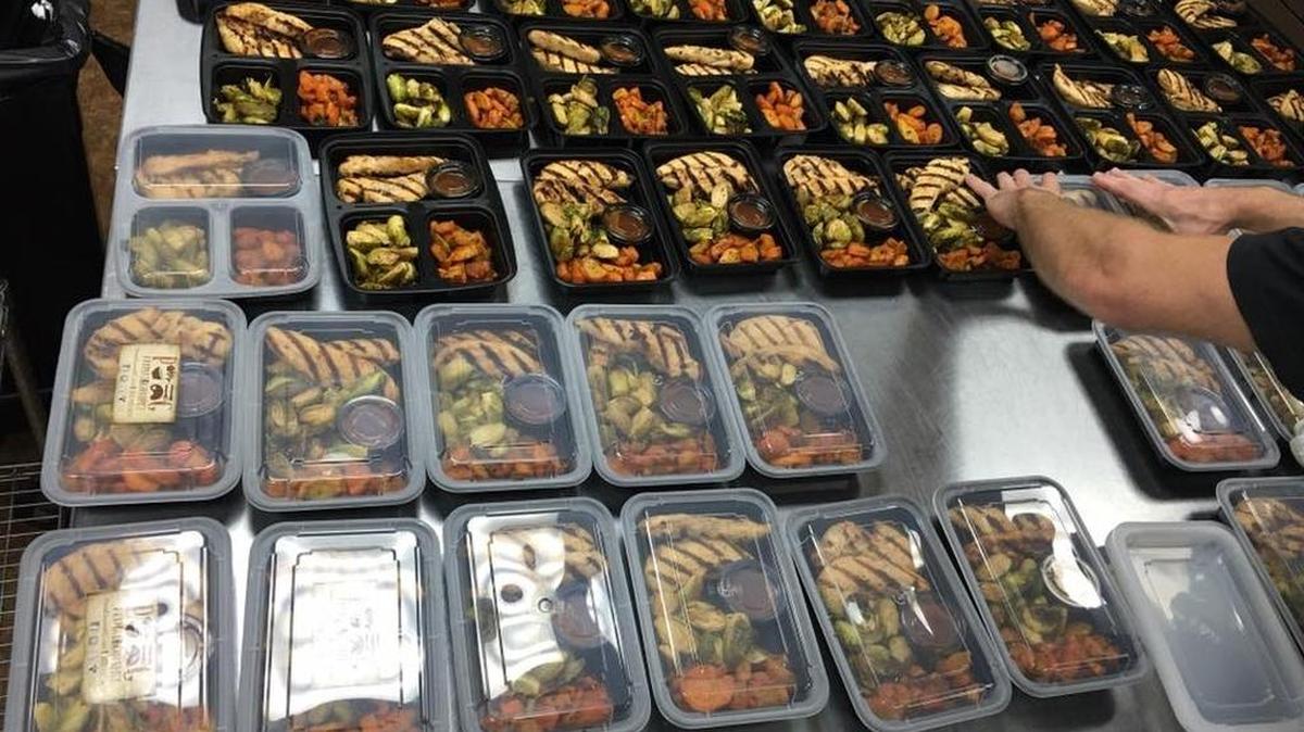 Healthy, pre-portioned meals to go are packaged at Primal Gourmet in this 2016 photo.